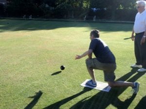 Jim Bowling on one knee